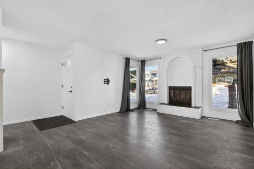 33 Sunhurst Crescent Se, Calgary, AB - Indoor Photo Showing Living Room With Fireplace