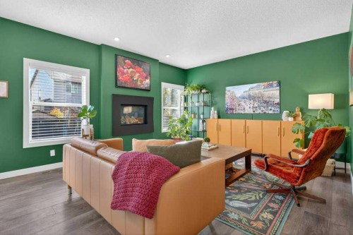 1091 Brightoncrest Green Se, Calgary, AB - Indoor Photo Showing Living Room With Fireplace