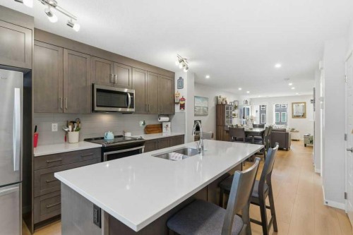 410-338 Seton Circle Se, Calgary, AB - Indoor Photo Showing Kitchen With Upgraded Kitchen