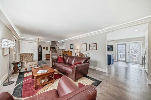 119 Pump Hill Bay Sw, Calgary, AB - Indoor Photo Showing Living Room