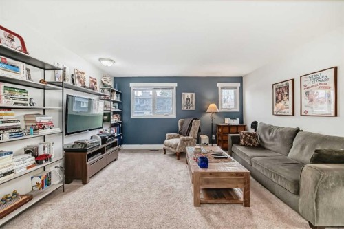 119 Pump Hill Bay Sw, Calgary, AB - Indoor Photo Showing Living Room