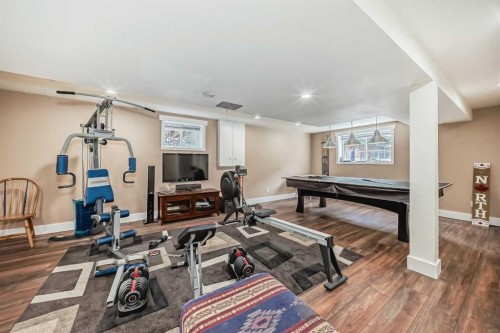 119 Pump Hill Bay Sw, Calgary, AB - Indoor Photo Showing Gym Room