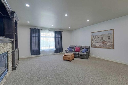 16 Rockcliff Point Nw, Calgary, AB - Indoor With Fireplace