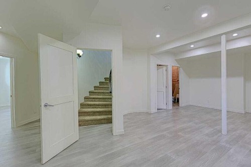 16 Rockcliff Point Nw, Calgary, AB - Indoor Photo Showing Other Room