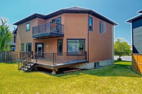 16 Rockcliff Point Nw, Calgary, AB - Outdoor With Deck Patio Veranda