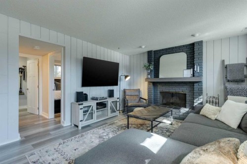 6616 Silverdale Road Nw, Calgary, AB - Indoor Photo Showing Living Room With Fireplace