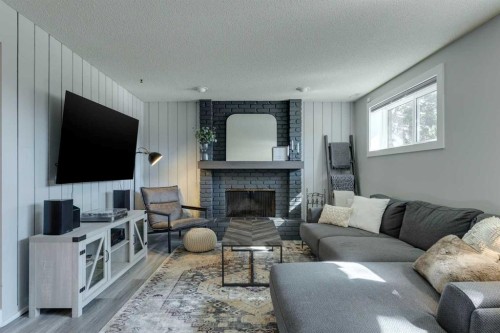 6616 Silverdale Road Nw, Calgary, AB - Indoor Photo Showing Living Room With Fireplace