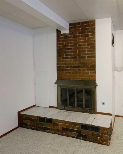 5402 12 Avenue, Edson, AB - Indoor Photo Showing Other Room With Fireplace