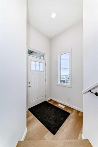 59 Versant Way Sw, Calgary, AB - Indoor Photo Showing Other Room