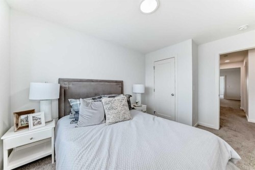 59 Versant Way Sw, Calgary, AB - Indoor Photo Showing Bedroom
