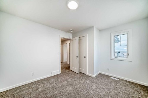 59 Versant Way Sw, Calgary, AB - Indoor Photo Showing Other Room
