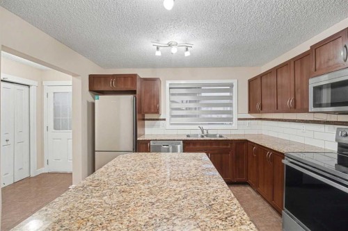 14 Skyview Point Link Ne, Calgary, AB - Indoor Photo Showing Kitchen With Double Sink