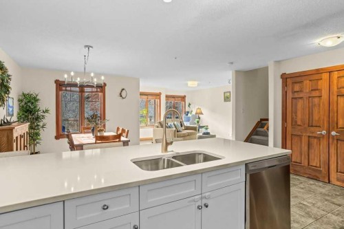 319-170 Crossbow Place, Canmore, AB - Indoor Photo Showing Kitchen With Double Sink
