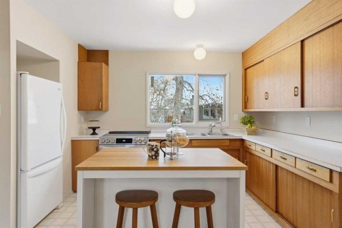 67 Woodlark Drive Sw, Calgary, AB - Indoor Photo Showing Kitchen With Double Sink