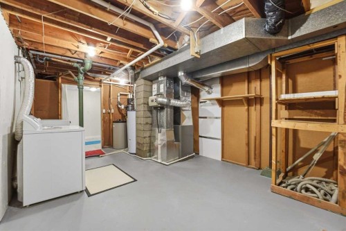 67 Woodlark Drive Sw, Calgary, AB - Indoor Photo Showing Basement