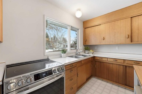 67 Woodlark Drive Sw, Calgary, AB - Indoor Photo Showing Kitchen With Double Sink