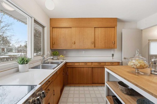 67 Woodlark Drive Sw, Calgary, AB - Indoor Photo Showing Kitchen With Double Sink
