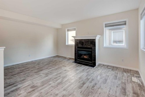 168 Simcoe Place Sw, Calgary, AB - Indoor Photo Showing Living Room With Fireplace