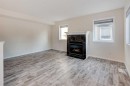 168 Simcoe Place Sw, Calgary, AB  - Indoor Photo Showing Living Room With Fireplace 