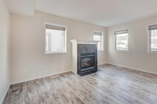 168 Simcoe Place Sw, Calgary, AB - Indoor Photo Showing Living Room With Fireplace