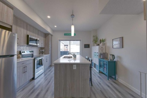 518 Canals Crossing, Airdrie, AB - Indoor Photo Showing Kitchen With Stainless Steel Kitchen With Upgraded Kitchen