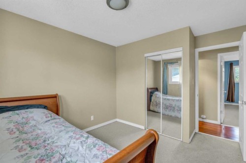 403 Queen Alexandra Way Se, Calgary, AB - Indoor Photo Showing Bedroom