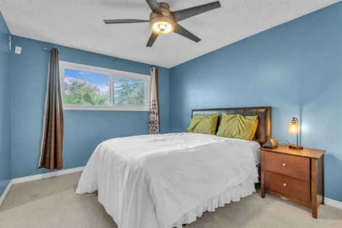 403 Queen Alexandra Way Se, Calgary, AB - Indoor Photo Showing Bedroom