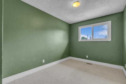 403 Queen Alexandra Way Se, Calgary, AB - Indoor Photo Showing Other Room