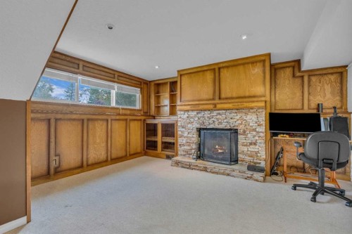 403 Queen Alexandra Way Se, Calgary, AB - Indoor With Fireplace