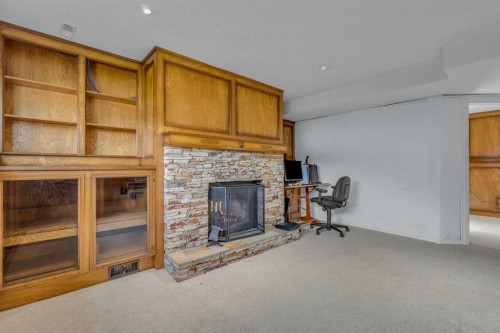 403 Queen Alexandra Way Se, Calgary, AB - Indoor With Fireplace
