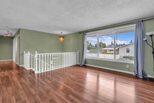 403 Queen Alexandra Way Se, Calgary, AB - Indoor Photo Showing Other Room