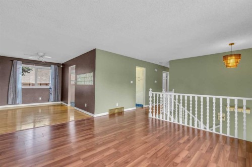 403 Queen Alexandra Way Se, Calgary, AB - Indoor Photo Showing Other Room
