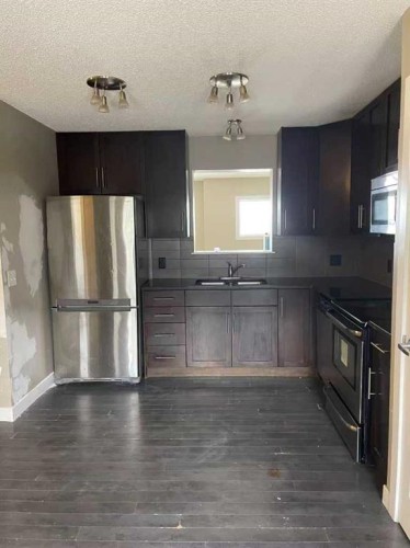 53 Panatella Road Nw, Calgary, AB - Indoor Photo Showing Kitchen With Stainless Steel Kitchen