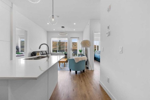3405-111 Wolf Creek Drive Se, Calgary, AB - Indoor Photo Showing Kitchen With Double Sink
