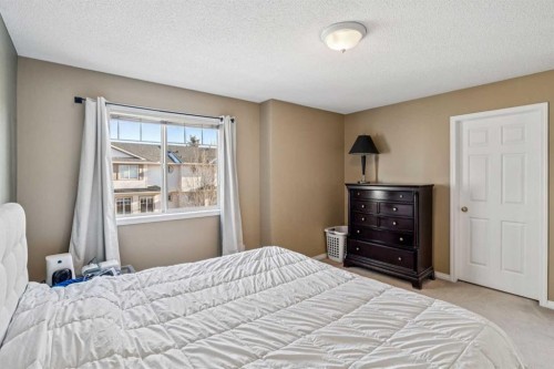 22 Country Hills Cove Nw, Calgary, AB - Indoor Photo Showing Bedroom