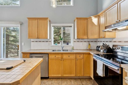 22 Country Hills Cove Nw, Calgary, AB - Indoor Photo Showing Kitchen With Double Sink