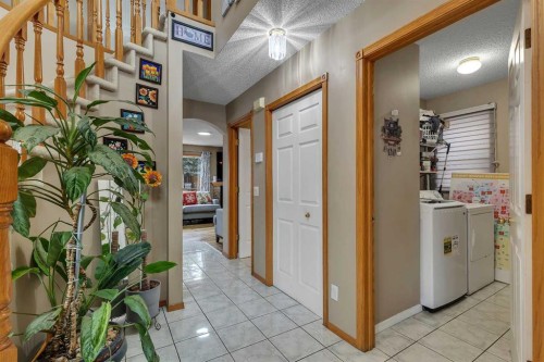 710 Coral Springs Boulevard Ne, Calgary, AB - Indoor Photo Showing Laundry Room