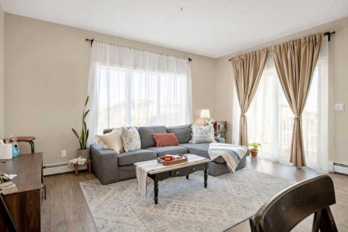 321-402 Marquis Lane Se, Calgary, AB - Indoor Photo Showing Living Room