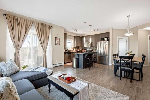 321-402 Marquis Lane Se, Calgary, AB - Indoor Photo Showing Living Room