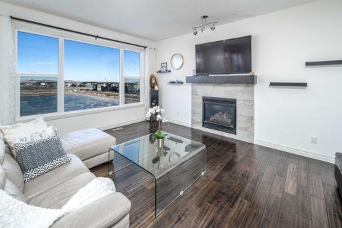 498 Sherwood Boulevard Nw, Calgary, AB - Indoor Photo Showing Living Room With Fireplace