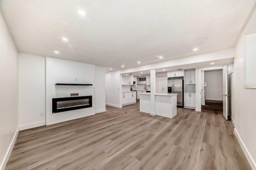 304 Huntbourne Hill Ne, Calgary, AB - Indoor Photo Showing Living Room With Fireplace