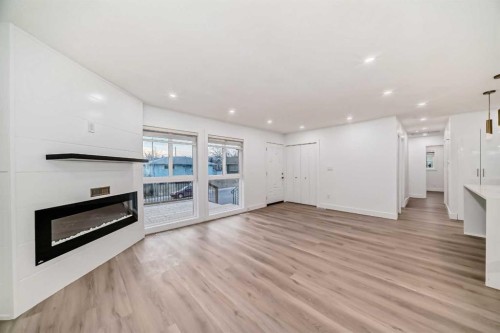 304 Huntbourne Hill Ne, Calgary, AB - Indoor Photo Showing Other Room With Fireplace
