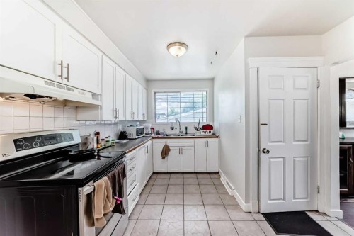 2208 47 Street Se, Calgary, AB - Indoor Photo Showing Kitchen With Double Sink