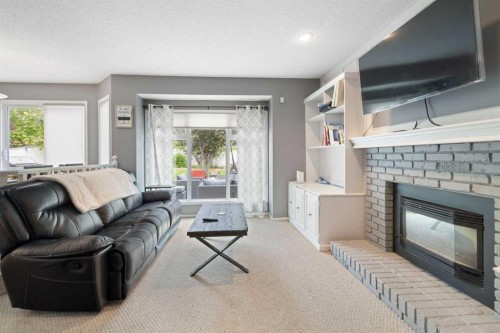 156 Woodfield Road Sw, Calgary, AB - Indoor Photo Showing Living Room With Fireplace