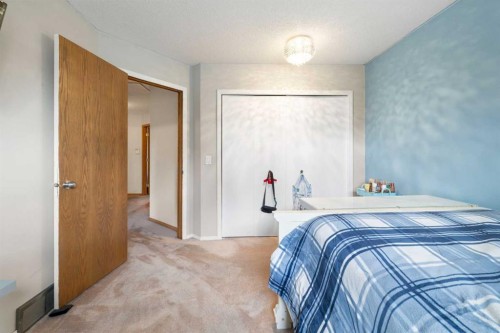 156 Woodfield Road Sw, Calgary, AB - Indoor Photo Showing Bedroom