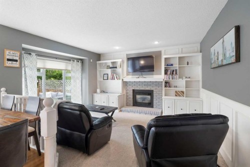 156 Woodfield Road Sw, Calgary, AB - Indoor Photo Showing Living Room With Fireplace
