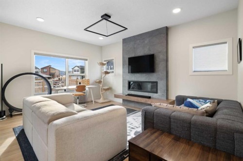 78 Silverton Glen Crescent Sw, Calgary, AB - Indoor Photo Showing Living Room With Fireplace