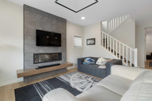 78 Silverton Glen Crescent Sw, Calgary, AB - Indoor Photo Showing Living Room With Fireplace