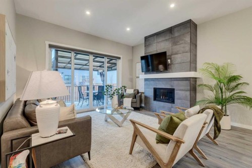 14 Cranbrook Common Se, Calgary, AB - Indoor Photo Showing Living Room With Fireplace