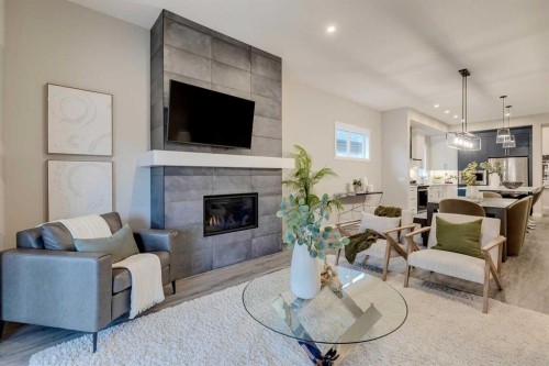 14 Cranbrook Common Se, Calgary, AB - Indoor Photo Showing Living Room With Fireplace